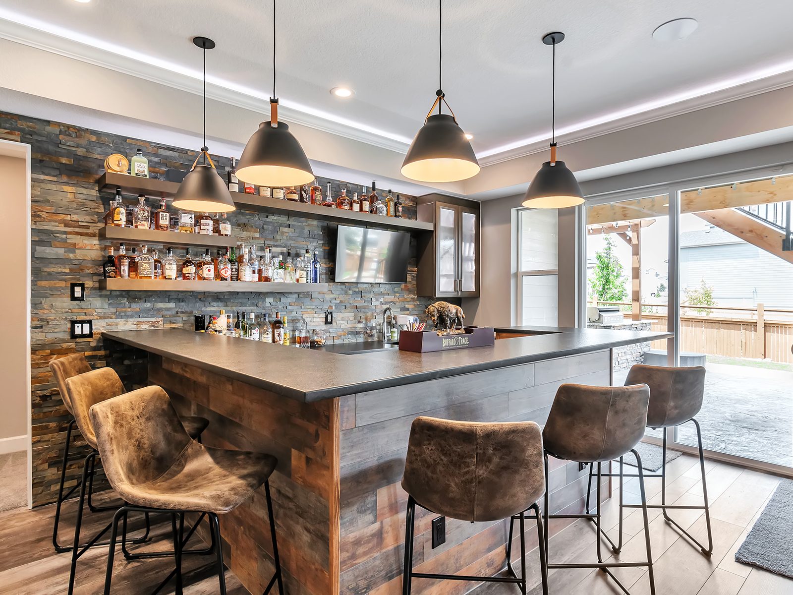 Finished basement with a reclaimed-wood bar